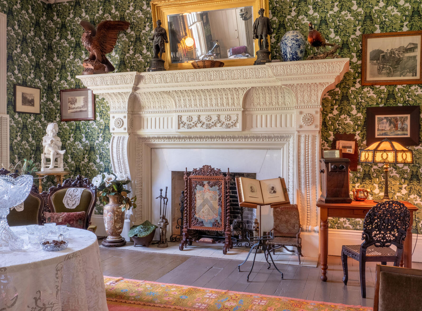 Large fireplace with decorative wooden mantle in the Family Room