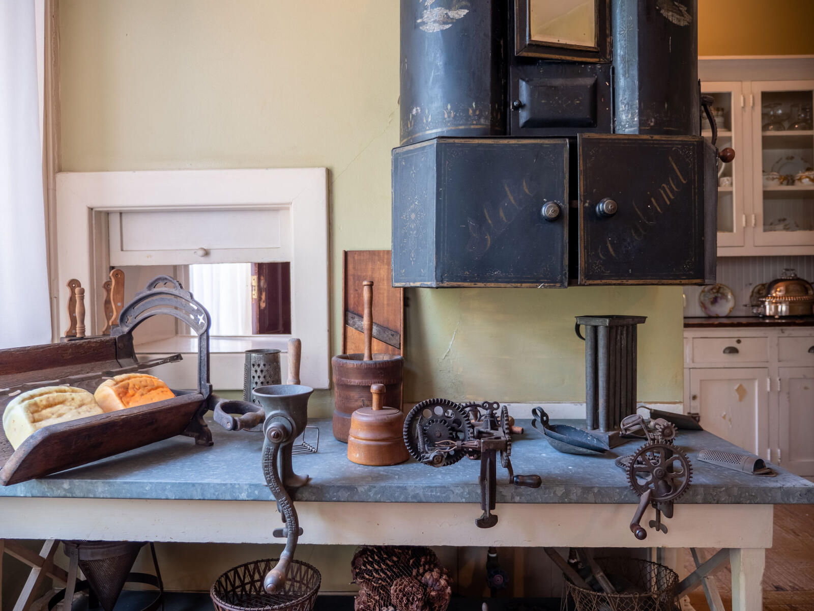 Victorian Era kitchen gadgets and spice cabinet