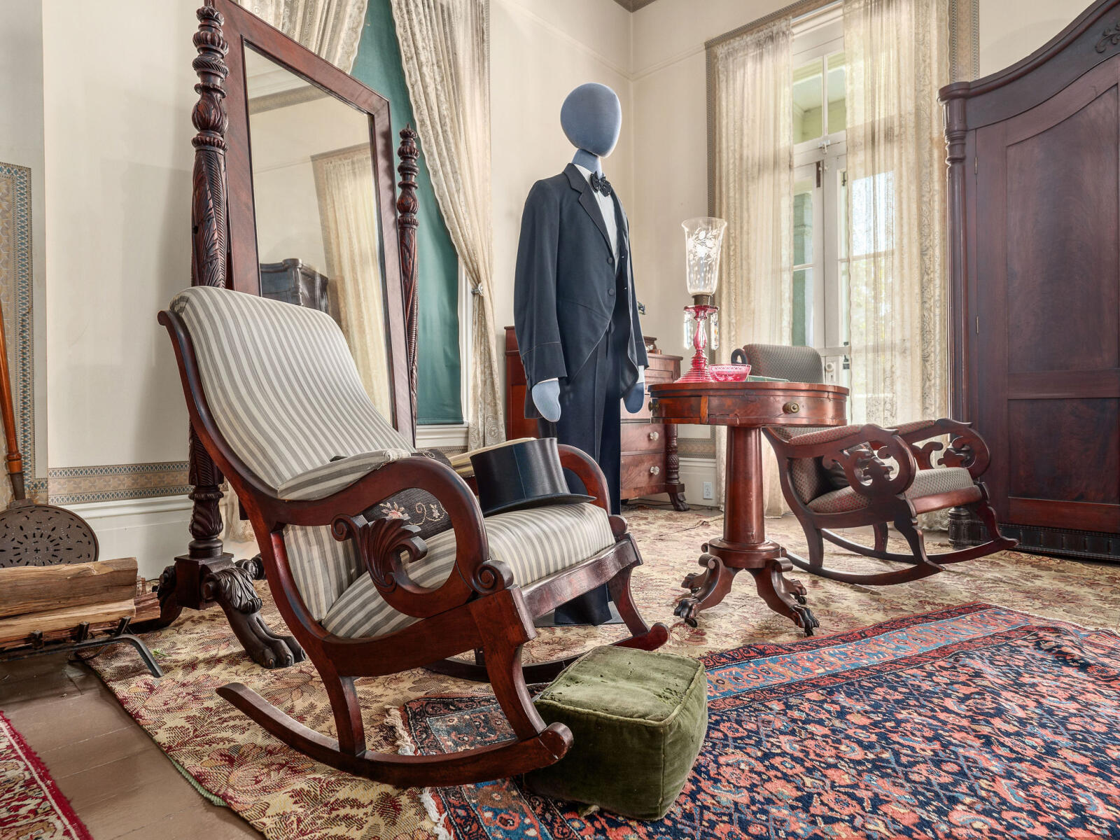 Rocking chair and male mannequin in the Master Bedroom